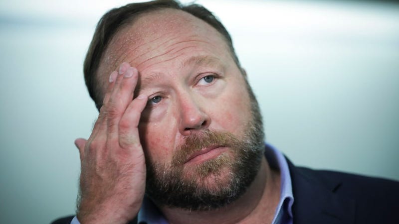 Alex Jones of InfoWars talks to reporters outside a Senate Intelligence Committee hearing concerning foreign influence operations' use of social media platforms, on Capitol Hill, September 5, 2018 in Washington, DC.