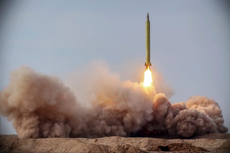 In this file photo released Jan. 16, 2021, by the Iranian Revolutionary Guard, a missile is launched in a drill in Iran. On Tuesday, Jan. 26, 2021, Iran warned the Biden administration that it will not have an indefinite time period to rejoin the 2015 nuclear deal between Tehran and world powers. Iran said it also expects Washington to swiftly lift crippling economic sanctions that former President Donald Trump imposed on the country after pulling America out of the atomic accord in 2018 as part of what he called maximum pressure against Iran. (Iranian Revolutionary Guard/Sepahnews via AP, File)