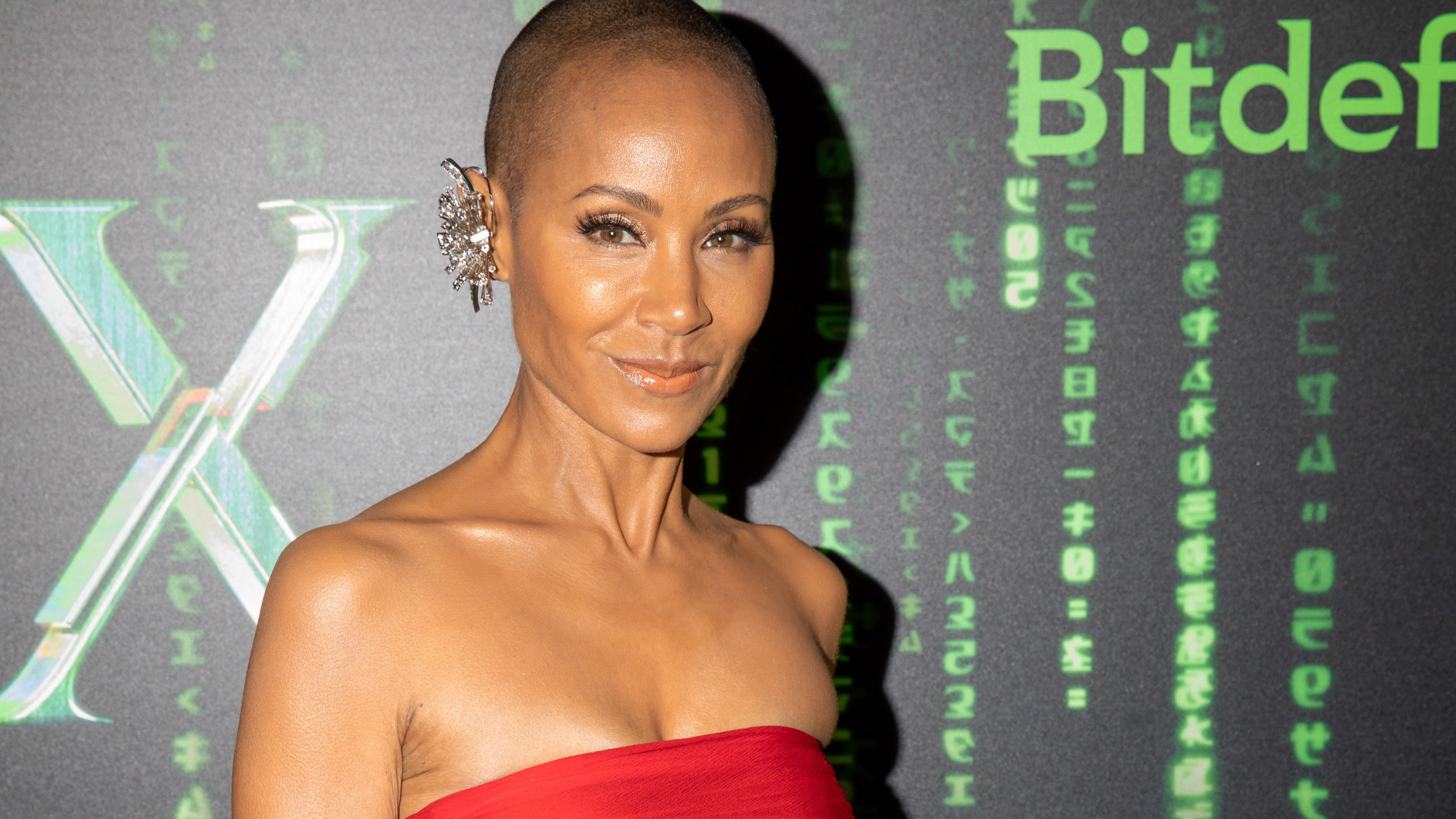 Jada Pinkett Smith is a vision in fire-red strapless gown at 'The Matrix Resurrections' premiere