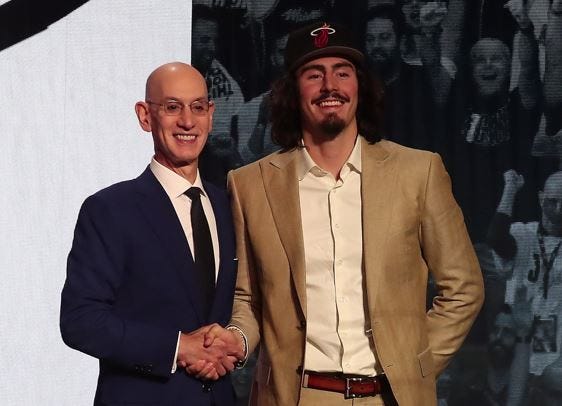 Jaime Jaquez Jr (UCLA) with NBA commissioner Adam Silver after being selected eighteenth by the Miami Heat in the first round of the 2023 NBA Draft at Barclays Arena.