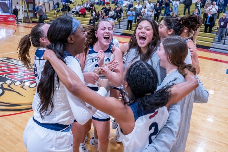 The Thomas Jefferson University women's basketball team celebrates their CACC championship.