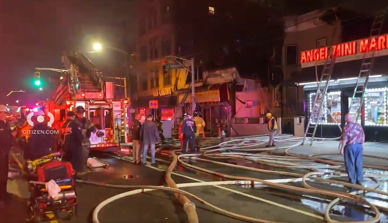 A fire spread from a Jersey City business to several residential buildings on Friday night, and firefighters responded to contain the blaze.