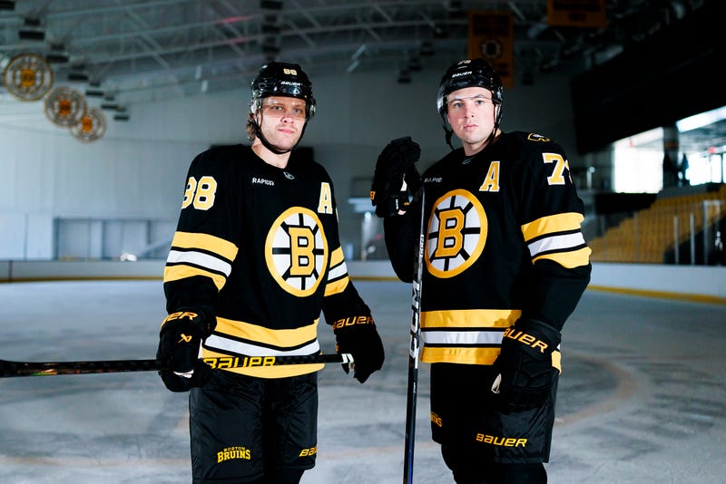 David Pastrnak and Charlie McAvoy model the Bruins' new uniforms