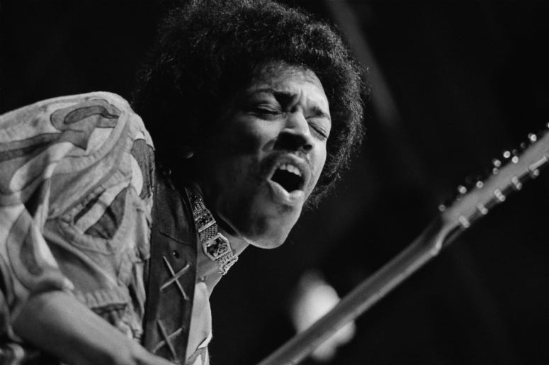 jimi hendrix rocking out on stage
