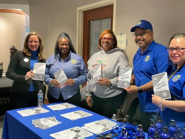 Secretary Benson and a community group at the Northwest Activities Center early voting site.