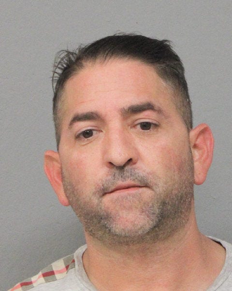 John Messina, 45, was arrested and charged after a woman was shot at while driving on Long Island Sunday night.