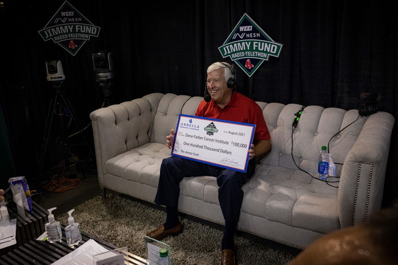 John Donohue of Arbella presents a $100,000 donation