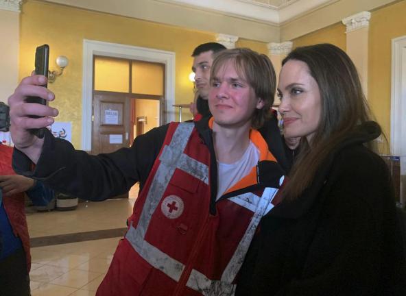 Angelina Jolie, Hollywood movie star and UNHCR goodwill ambassador, poses for photo with her fans in Lviv, Ukraine, Saturday, April 30, 2022. Ms Jolie was in Ukraine to meet the children affected by the war and visited hospitals and NGOs helping the injured and displaced.