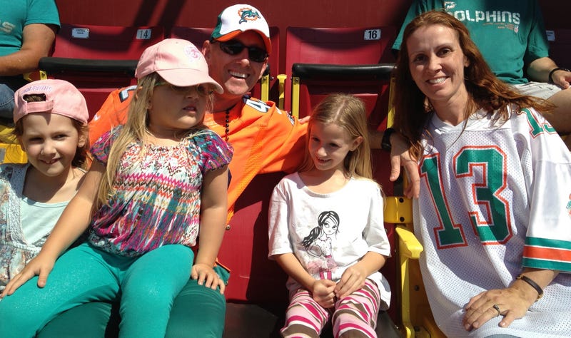 Jonathan Knauth enjoying a Miami Dolphins game with his family.