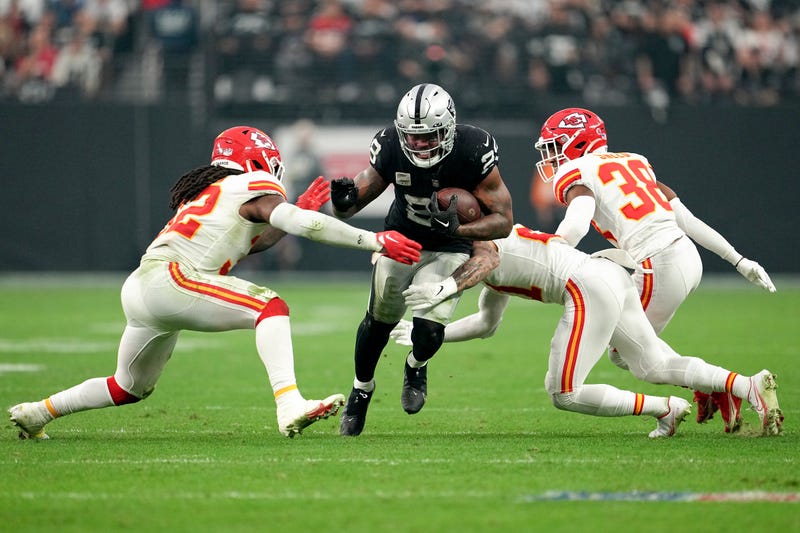 Josh Jacobs #28 of the Las Vegas Raiders carries the ball against the Kansas City Chiefs during the second half of the game at Allegiant Stadium on January 07, 2023 in Las Vegas, Nevada