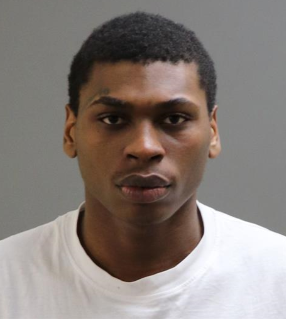 Black man in 20s wearing black hoodie 