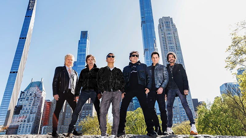 Journey band members in front of city skyline