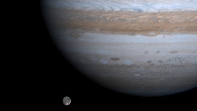 The solar system's largest moon, Ganymede, is captured here alongside the planet Jupiter in this picture taken by NASA's Cassini spacecraft, December 3, 2000. 