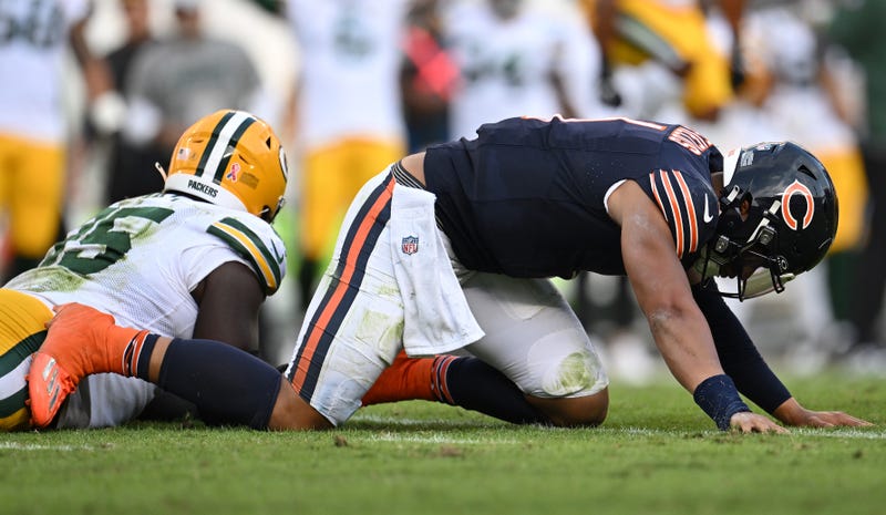 Bears quarterback Justin Fields reacts after fumbling in a loss to the Packers.