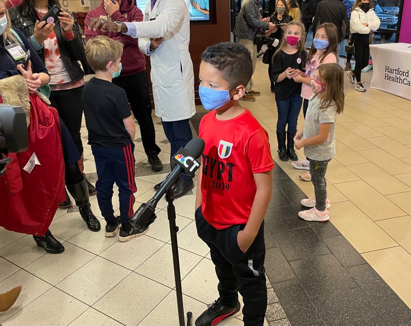 Kareem Omar of Simsbury does his media rounds after receiving his second dose of the Pfizer COVID vaccine, 11/24/21. Previously, Kareem was the first child in the nation to receive the first dose.
