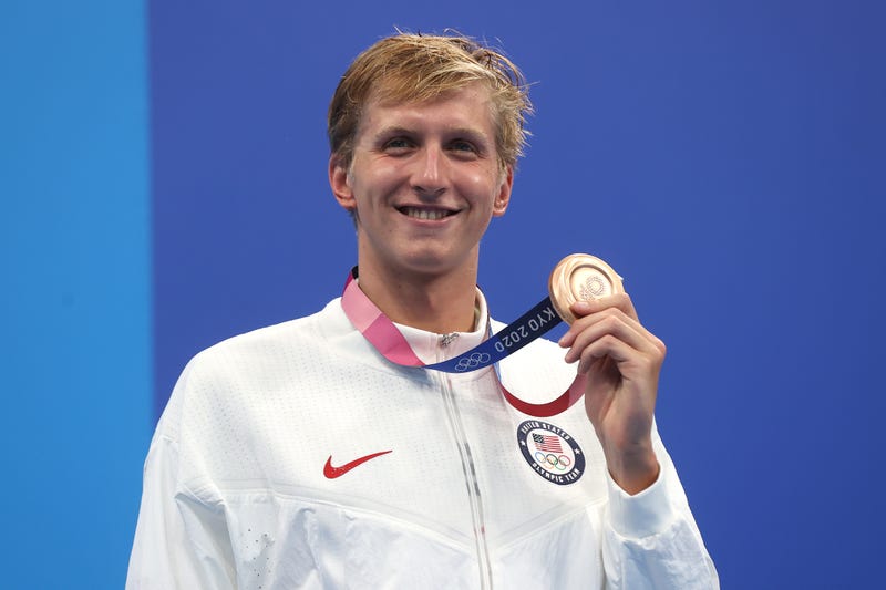 Swimmer Kieran Smith, of Ridgefield, CT, holds up his bronze medal from the Men's 400m Freestyle Final at the Olympics in Tokyo, 7/25/21