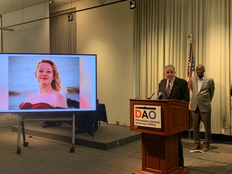 District Attorney Larry Krasner speaks at a press conference on Jan. 8, 2026 alongside a photo of Renee Nicole Good.