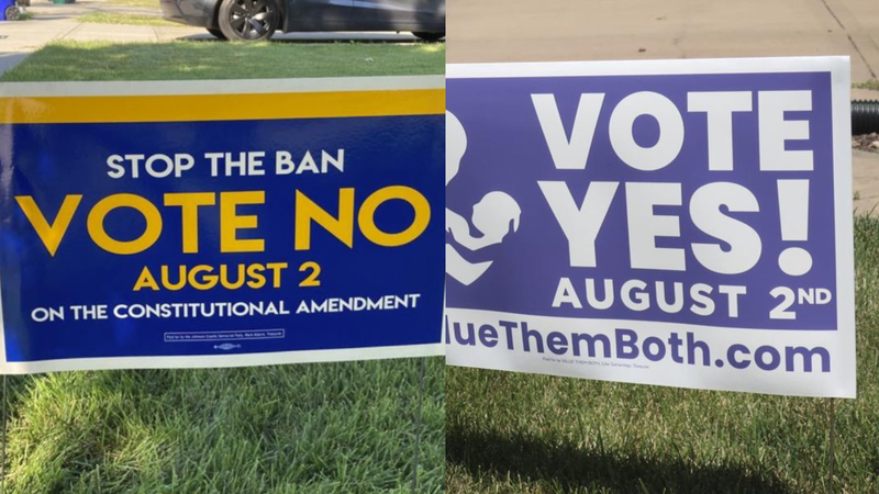 Opposing yard signs for Kansas amendment vote