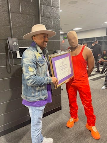 Morris Brown College gave Kanye West with a plaque honoring his late mother and a resolution recognizing Kanye.