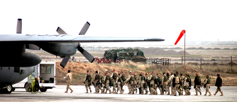 Army troops follow an airman at Karshi-Khanbad Air Base in Uzbekistan.