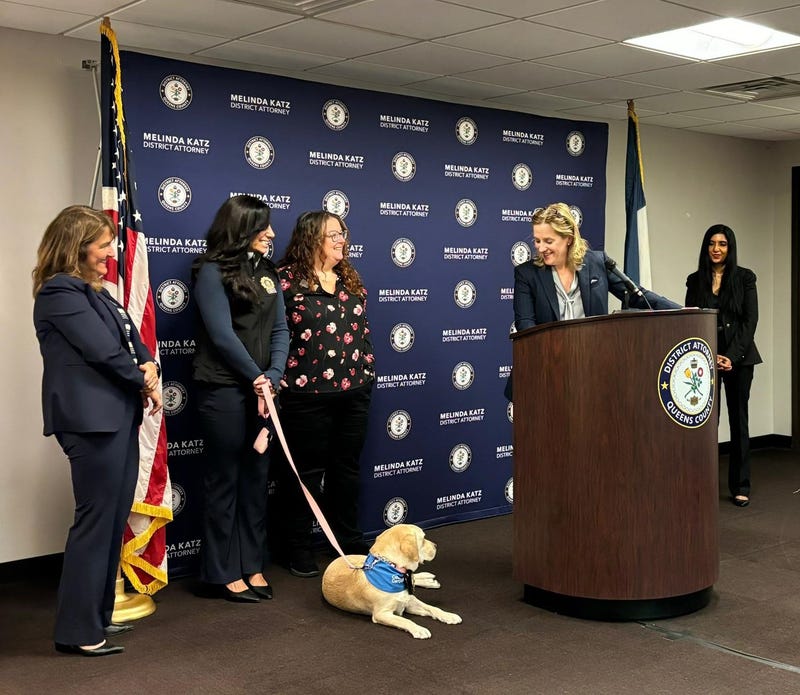 Queens District Attorney Melinda Katz at a press conference announcing Kimi, a trained facility dog who will provide comfort to special victims and victims of domestic violence at the office.