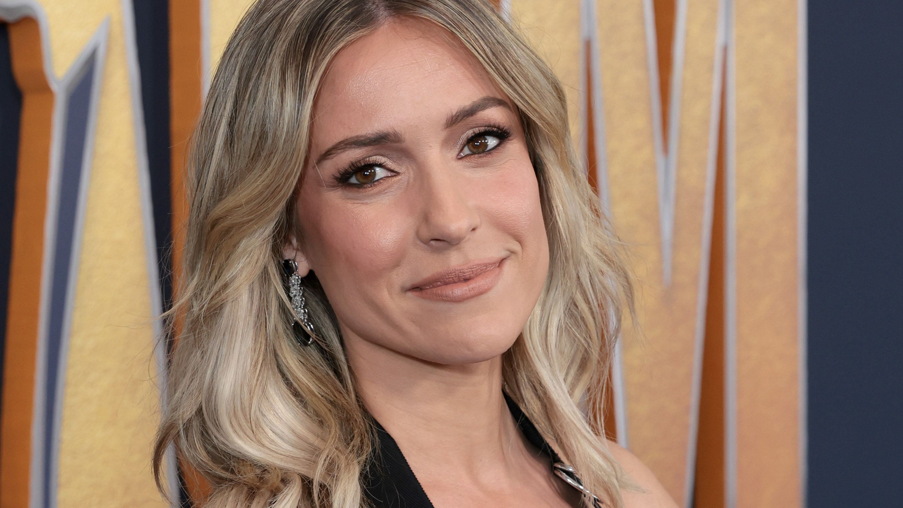 Kristin Cavallari is 'sun kissed' as she poses in a white bikini at the beach
