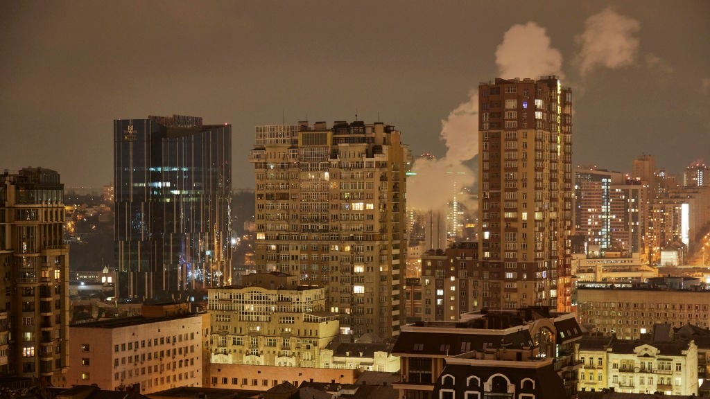 WATCH: Blasts light up Kyiv behind reporters