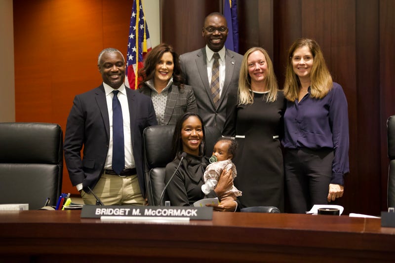 Kyra Harris Bolden, with family, Gov. Gretchen Whitmer and others