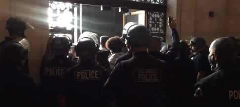 Police at LA City Council meeting blocking protestors