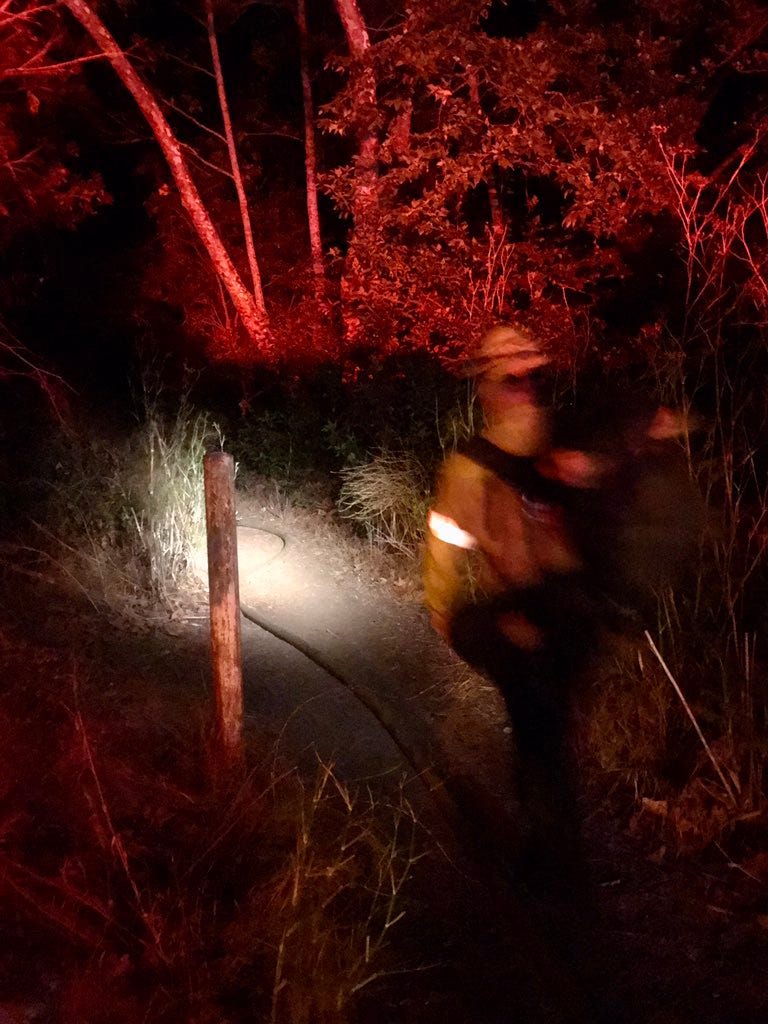 Firefighters hike 2,000 feet through a narrow path to the battle a five-acre brush fire in Tuna Canyon.  