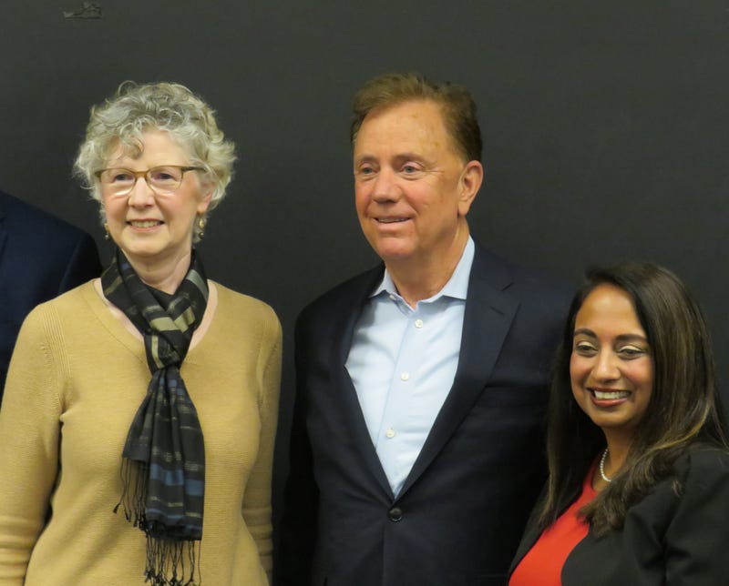 Gov. Ned Lamont poses with former acting Public Health commissioner Dr. Deidre Gifford (L) and current Public Health commissioner Dr. Manisha Juthani in New Haven, 5/10/23