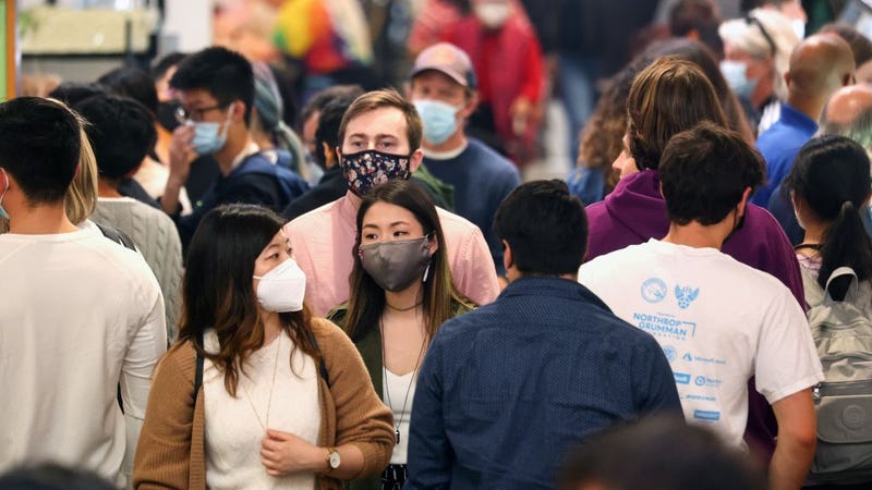 People walk and gather inside Grand Central Market while many wear face coverings on March 3, 2022 in Los Angeles, California. 
