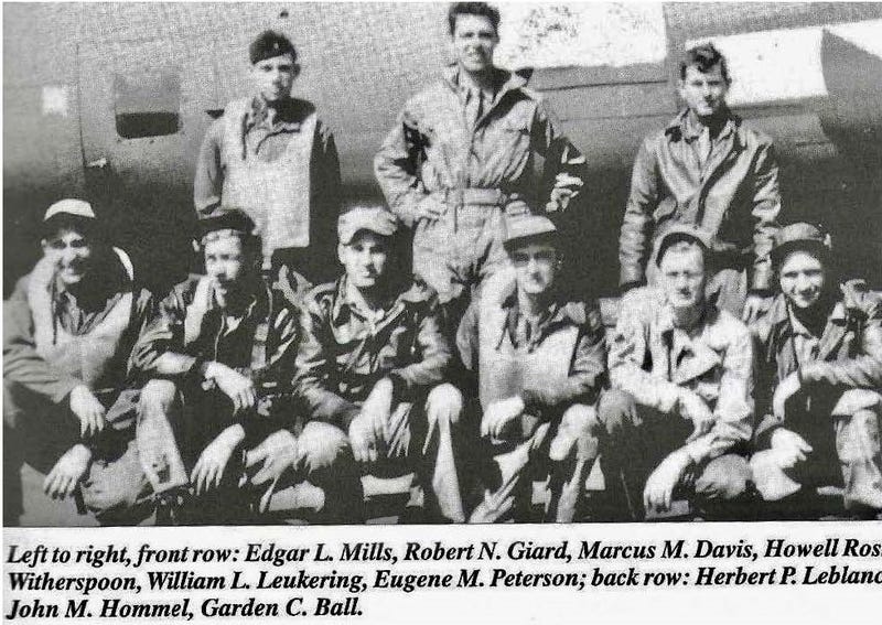 A photo shared by the Defense POW/MIA Accounting Agency shows Sgt. William L. Leukering (front row, second from the right), along with the other 10 crew members on his B-17.