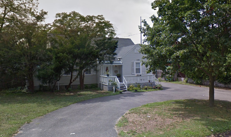 A shooting broke out at a party at 1320 Ackerson Blvd. in Bay Shore, pictured above, on Friday evening, leaving one teen dead and another hospitalized.