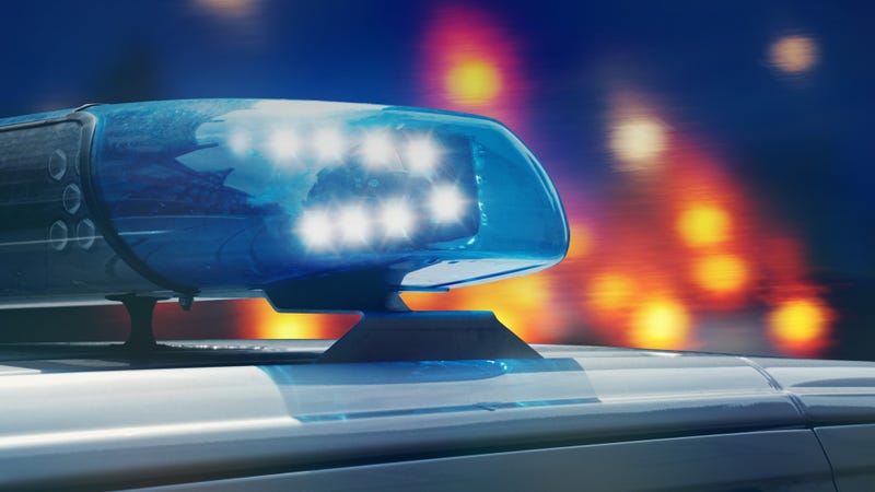 Police patrol car on the road at night - stock photo