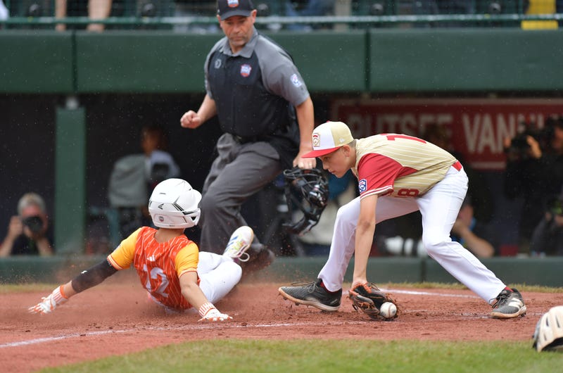 A play at the plate during a Little League World Series game between Nevada and Texas.