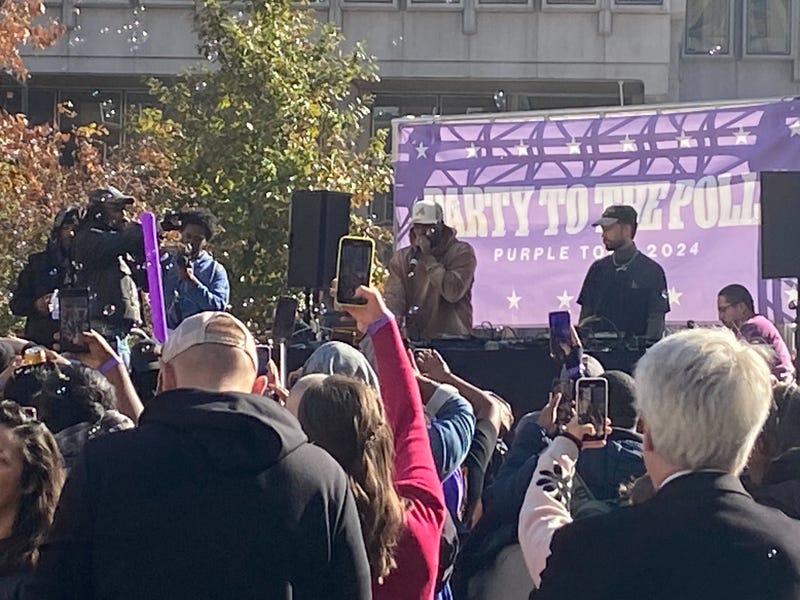 A DJ plays music and talks to the crowd gathered in LOVE Park on Tuesday for the dance party to the polls.