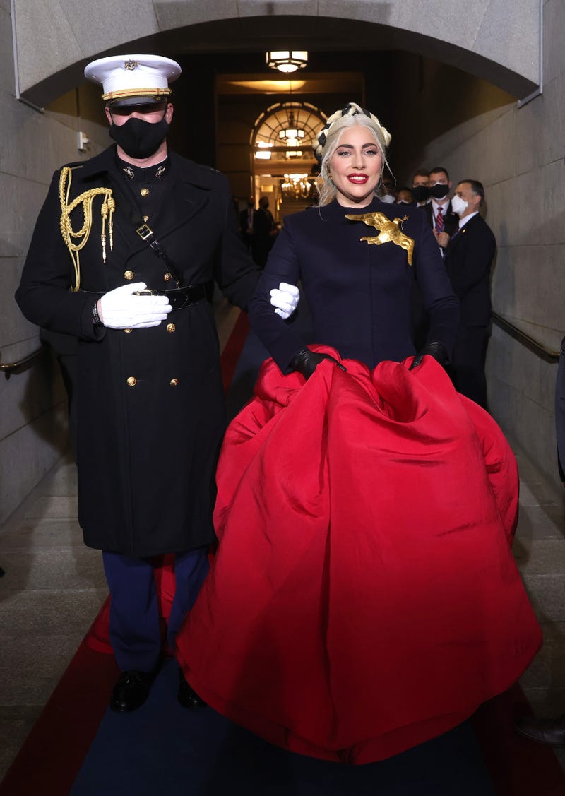 Lady Gaga is escorted by U.S. Marine escort Capt. Evan Campbell to sing the National Anthem at the inauguration of U.S. President-elect Joe Biden on the West Front of the U.S. Capitol on January 20, 2021 in Washington, DC. During today’s inauguration ceremony Joe Biden becomes the 46th president of the United States.