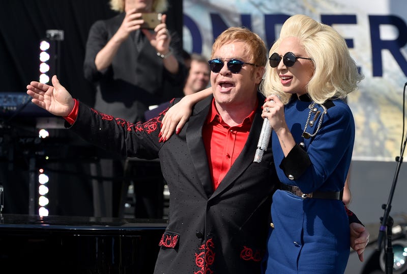 Elton John (L) and Lady Gaga perform live on the Sunset Strip, on February 27, 2016, as a thank you to the City of West Hollywood for their support of the Elton John AIDS Foundation. The concert was streamed live on AOL.com and co-presented by AOL and BBVA.