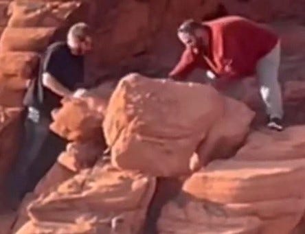 Two men move rock formations at the Lake Mead National Recreation Area
