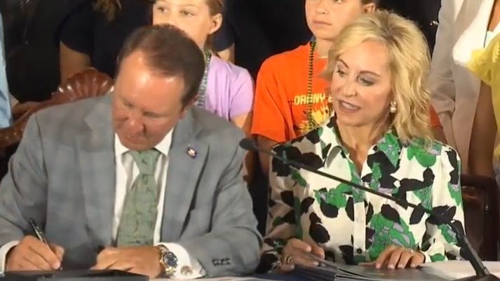 Landry signs private school voucher, 10 Commandments bills
