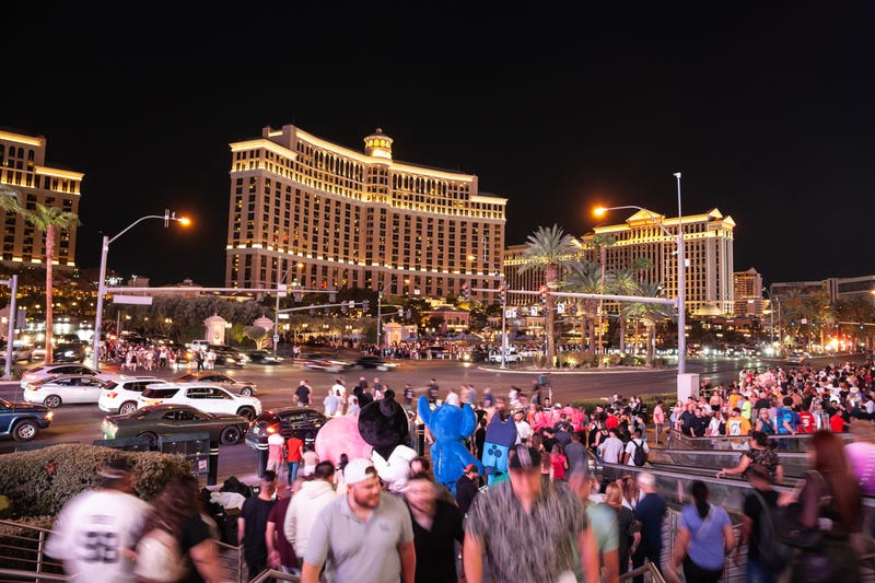 Tourists stroll the Las Vegas Strip after dark.