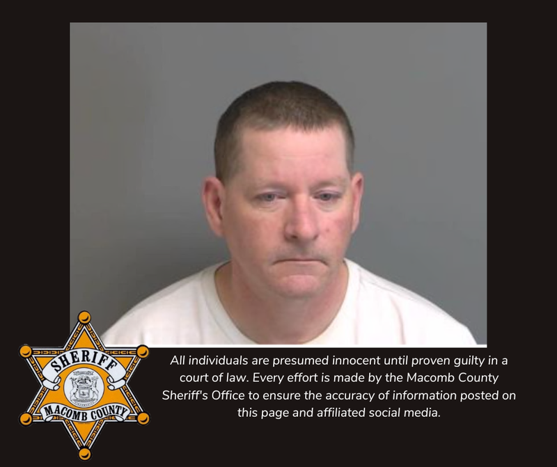 Mugshot of older man in white shirt 