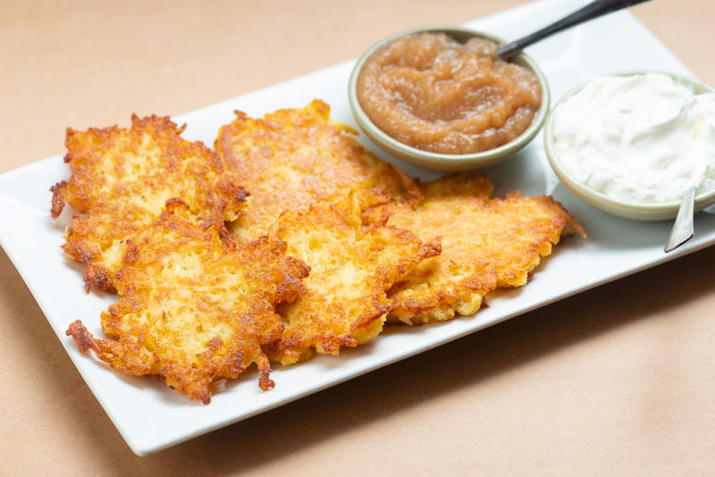 Potato latkes with homemade apple sauce and sour cream from Breads Bakery for Hanukkah 2024