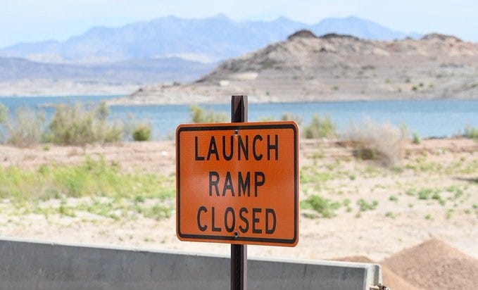 A sign indicates a boat launch ramp cannot be used
