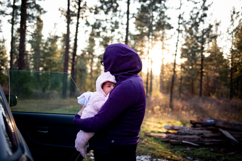 Leah Nelson brings her newborn into the woods for the first time. Flathead Indian Reservation, Montana