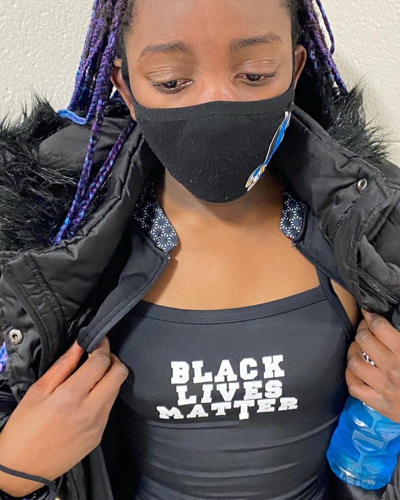 Leidy, a 12-year-old swimmer who was nearly disqualified from a swim meet for wearing this Black Lives Matter swimsuit. 