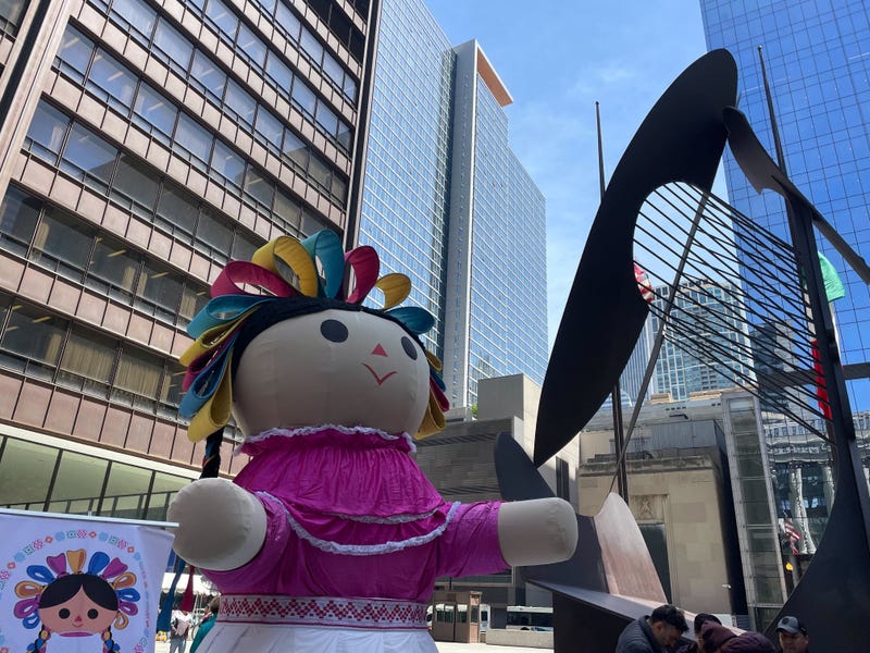 giant doll by Picasso statue