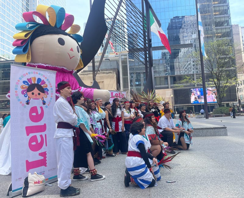 giant doll and students at Daley Plaza in Chicago