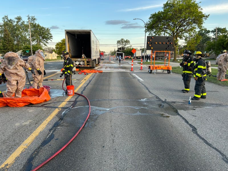 The Livonia Fire Department works to clean up an acid spill on Eight Mile near Middlebelt